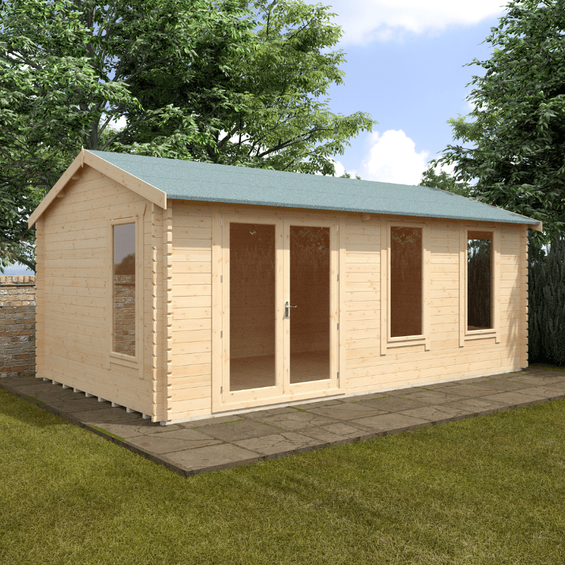 Wooden garden shed with a green roof on a grassy area with trees in the background