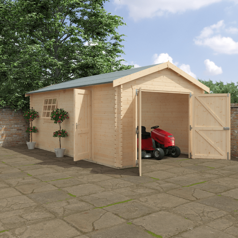 Wooden garage with open doors on a stone patio, surrounded by trees and a clear sky.