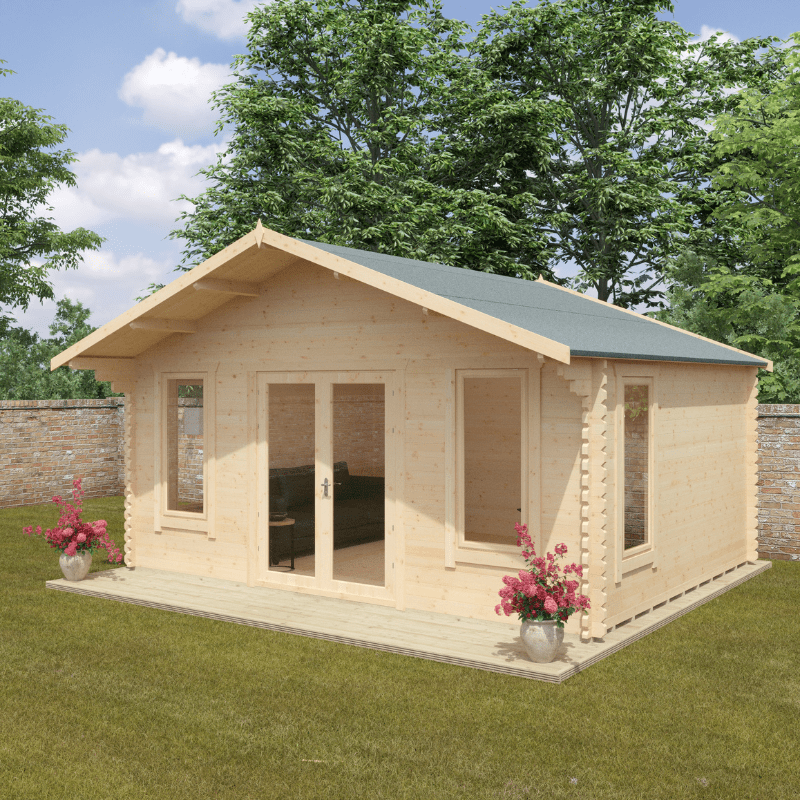 Wooden cabin with a green roof on a grassy area with trees in the background