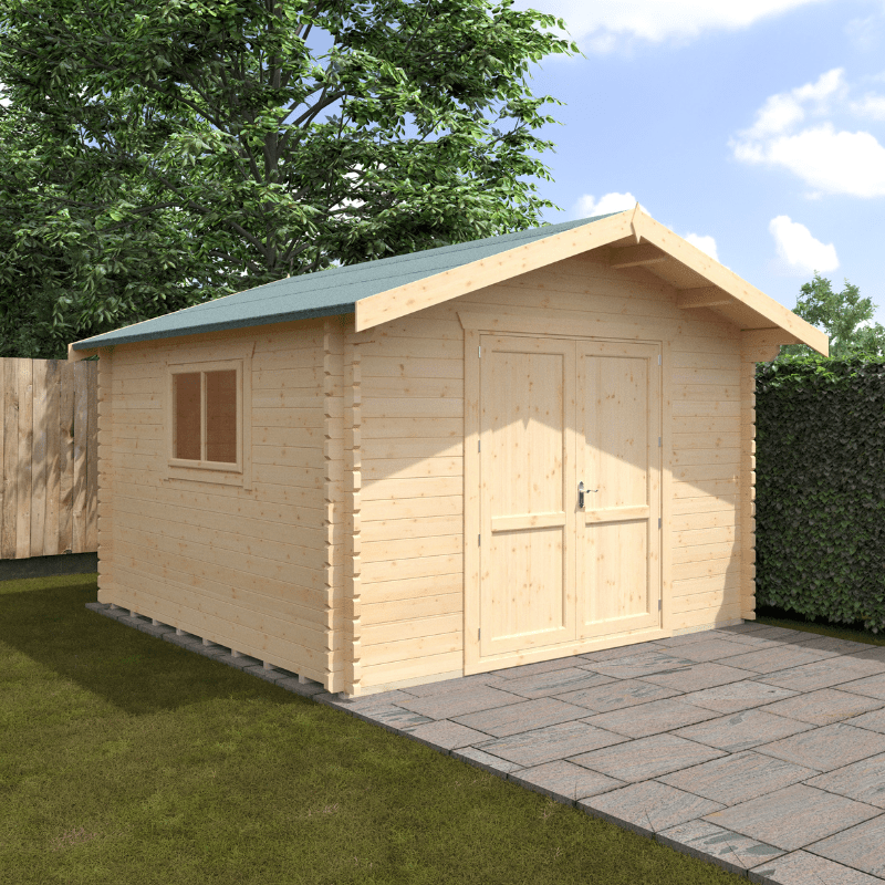 Wooden shed with a green roof on a grassy area with trees in the background