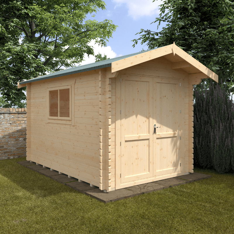 Wooden shed with a green roof on a grassy area with trees and a blue sky in the background