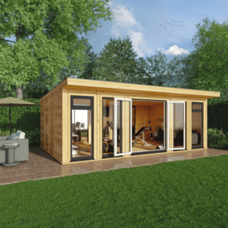Wooden garden office with large windows in a garden setting