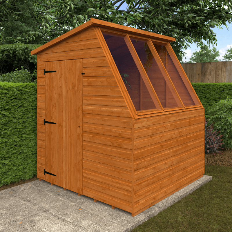 Wooden shed with a slanted roof in a garden setting