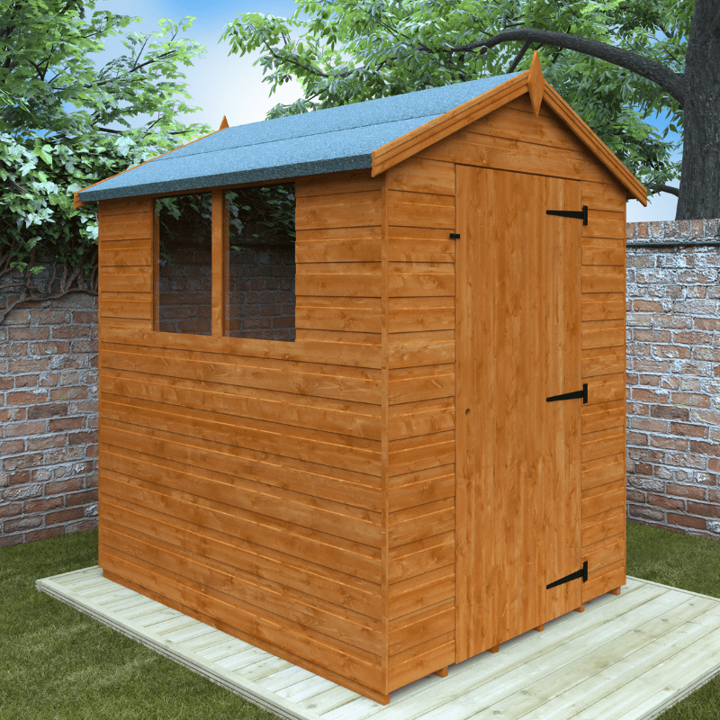 Wooden shed with a green roof in a garden setting