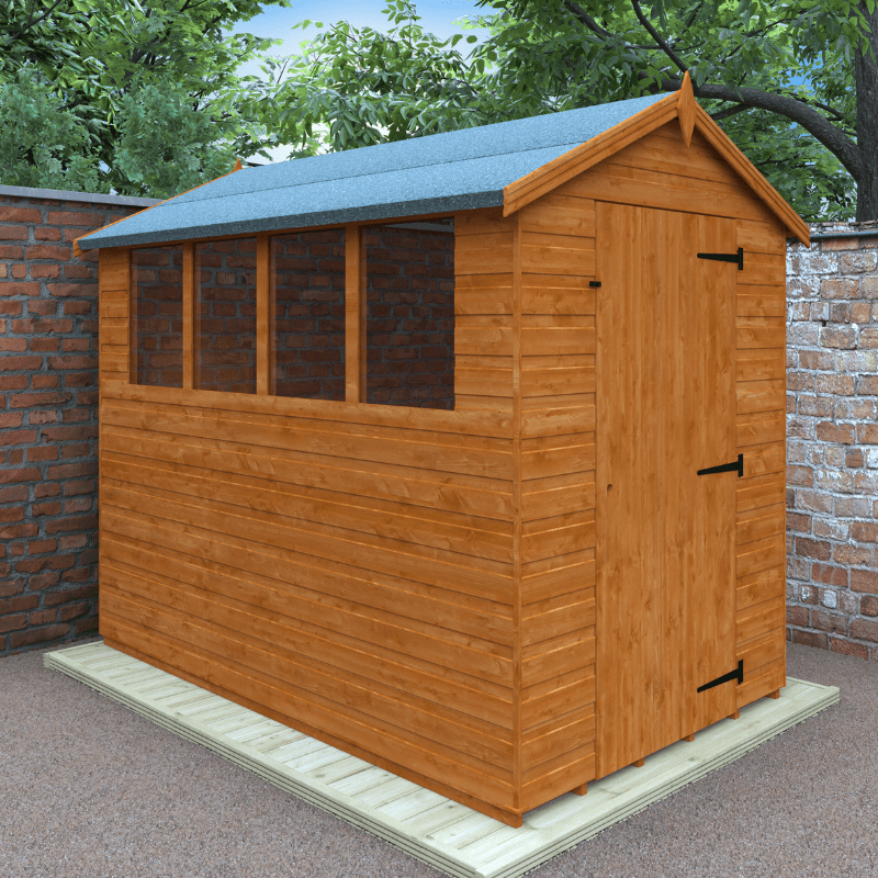 Wooden shed with a green roof in a garden setting