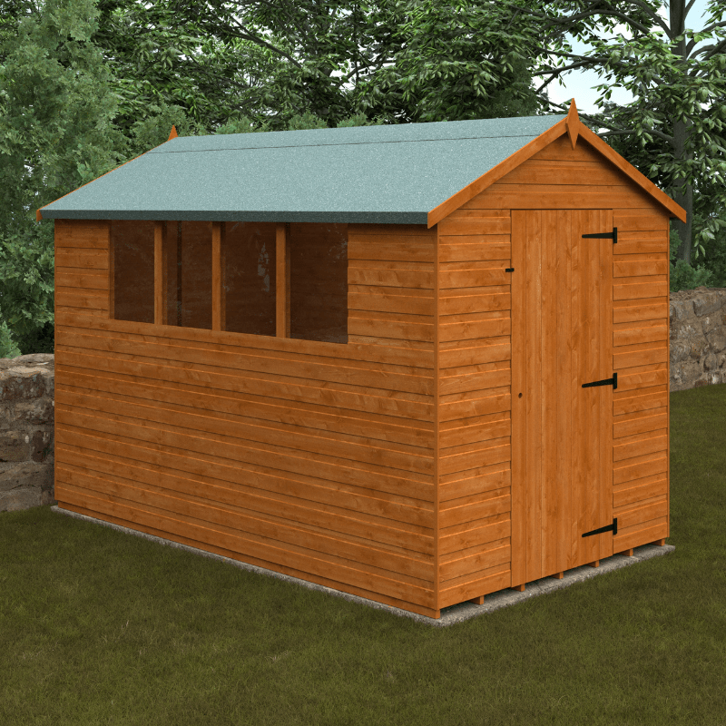 Wooden shed with a green roof in a garden setting