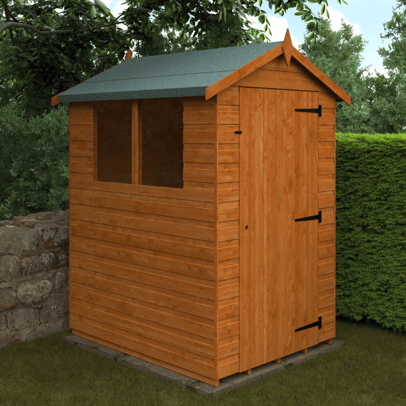 Wooden shed with a green roof in a garden setting