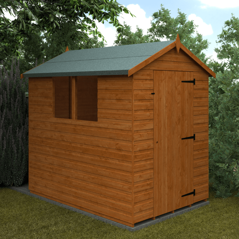 Wooden shed with a green roof in a garden setting