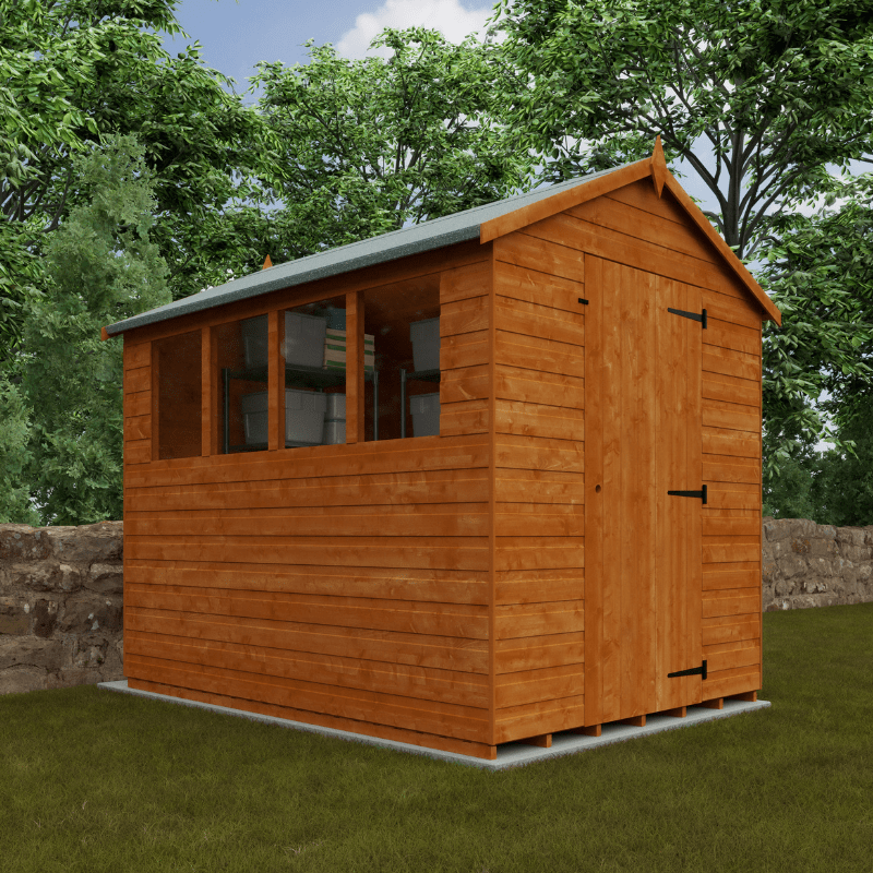 Wooden shed with a slanted roof in a garden setting with trees and a stone wall.