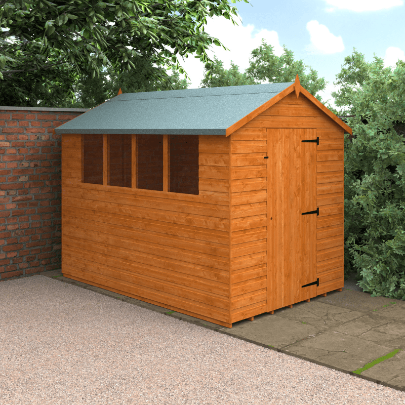 Wooden shed with a green roof in a garden setting