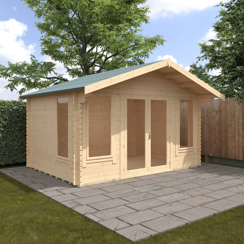 Wooden garden shed with a green roof on a paved patio area with trees in the background