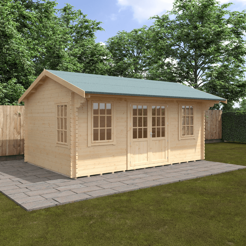 Wooden cabin with green roof on a grassy area with trees in the background