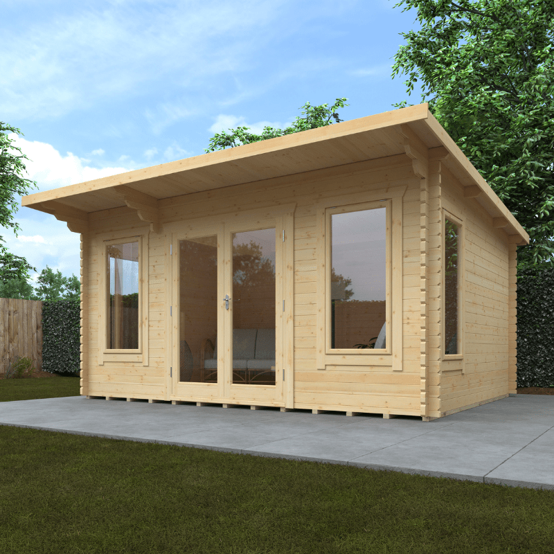 Wooden garden shed with large windows on a grassy area with trees in the background