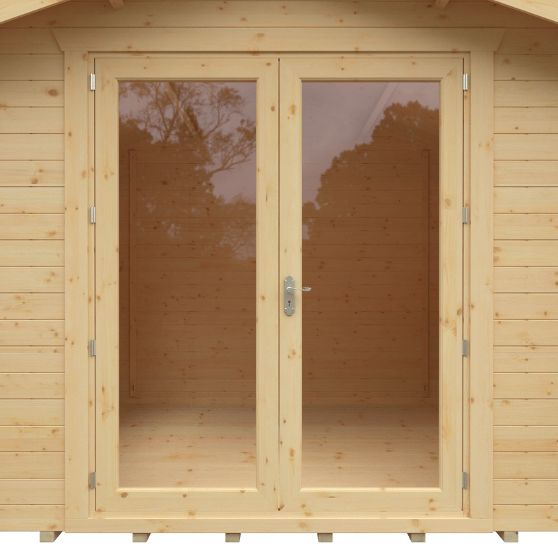 Wooden shed with glass doors and visible trees in the reflection
