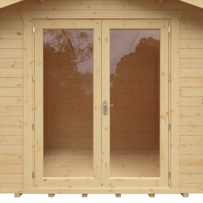 Wooden shed with glass doors and visible trees in the reflection
