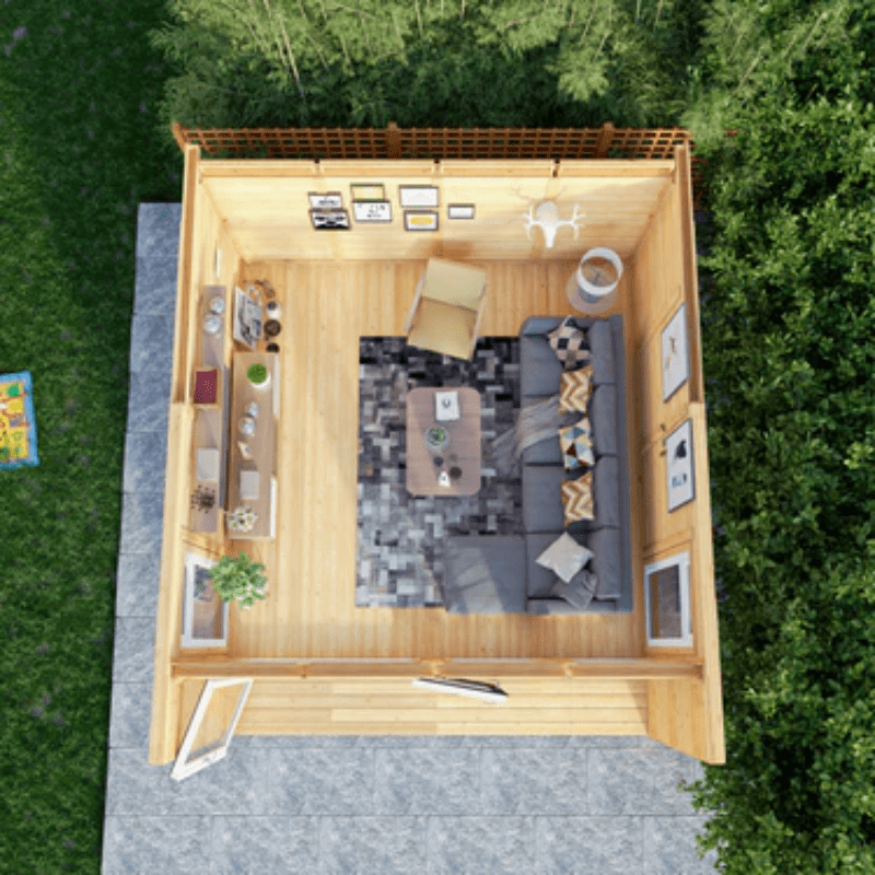 Top-down view of a small wooden cabin with interior furniture and decor.