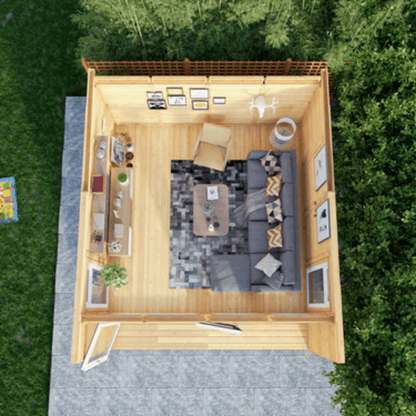 Top-down view of a small wooden cabin with interior furniture and decor.