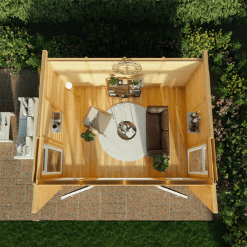 Top-down view of a wooden cabin with interior furniture and decor.