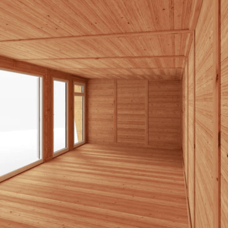 Wooden interior with large windows allowing natural light.