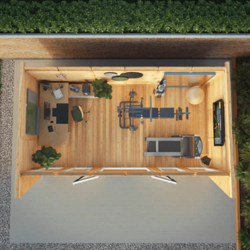 Top-down view of a home office setup inside a wooden shed.