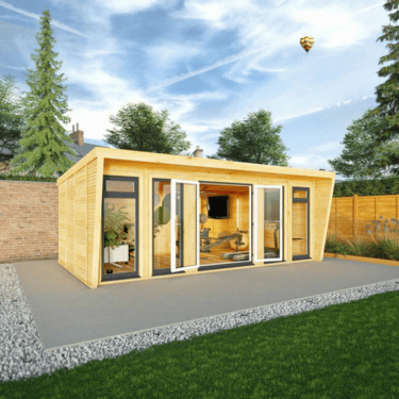 Wooden garden office with large windows in a garden setting