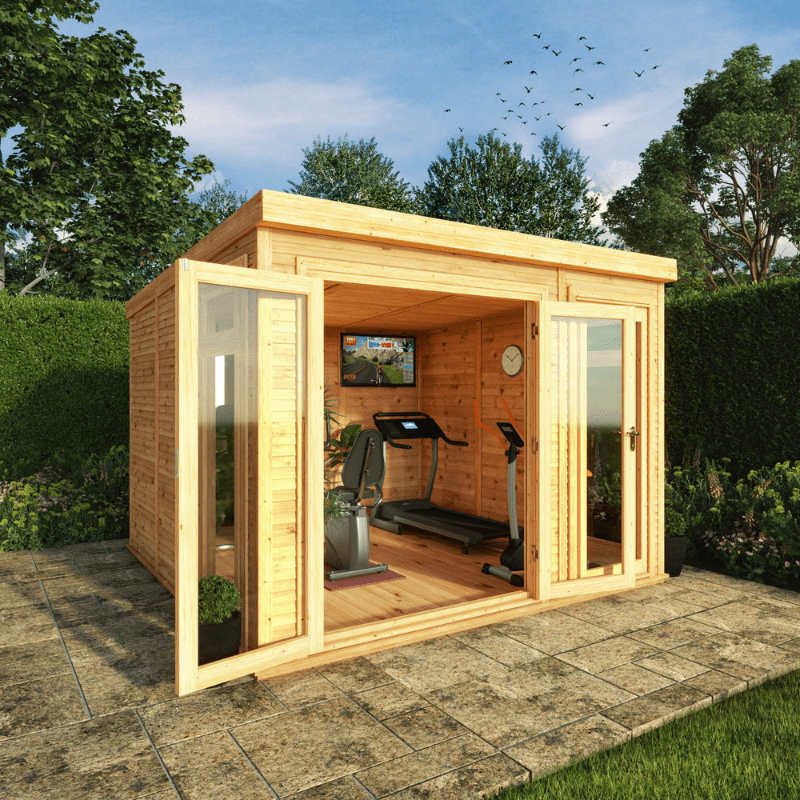 Wooden garden office with exercise equipment inside, surrounded by greenery.