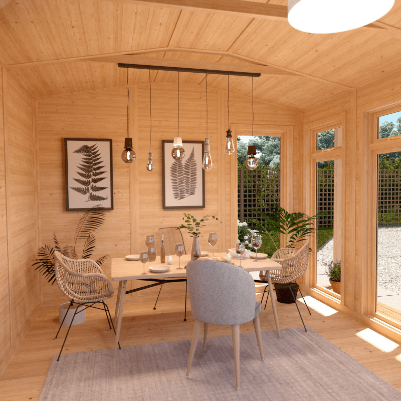 Dining area with wooden walls, a table, chairs, and large windows.