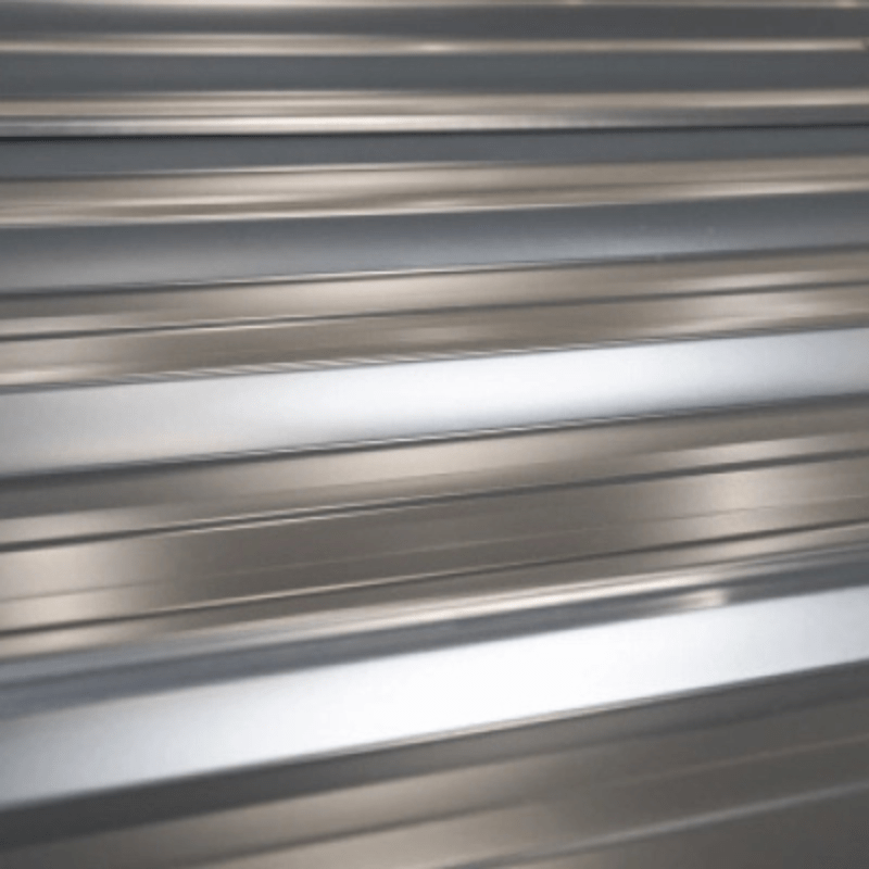 Close-up of metallic sheet with horizontal ribbed pattern