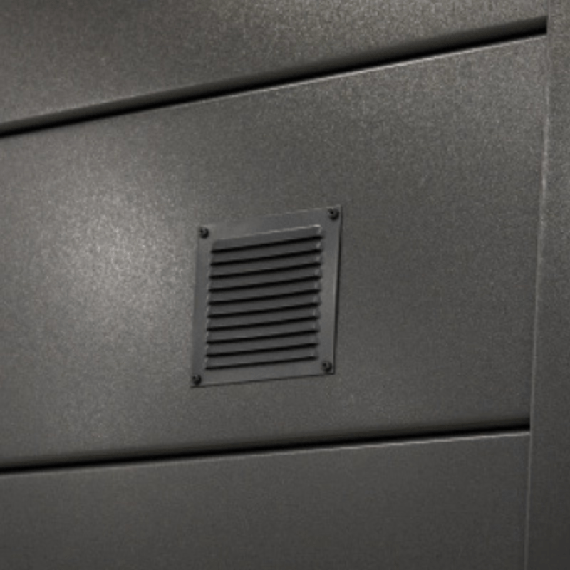 Metallic surface with a vent on a gray background