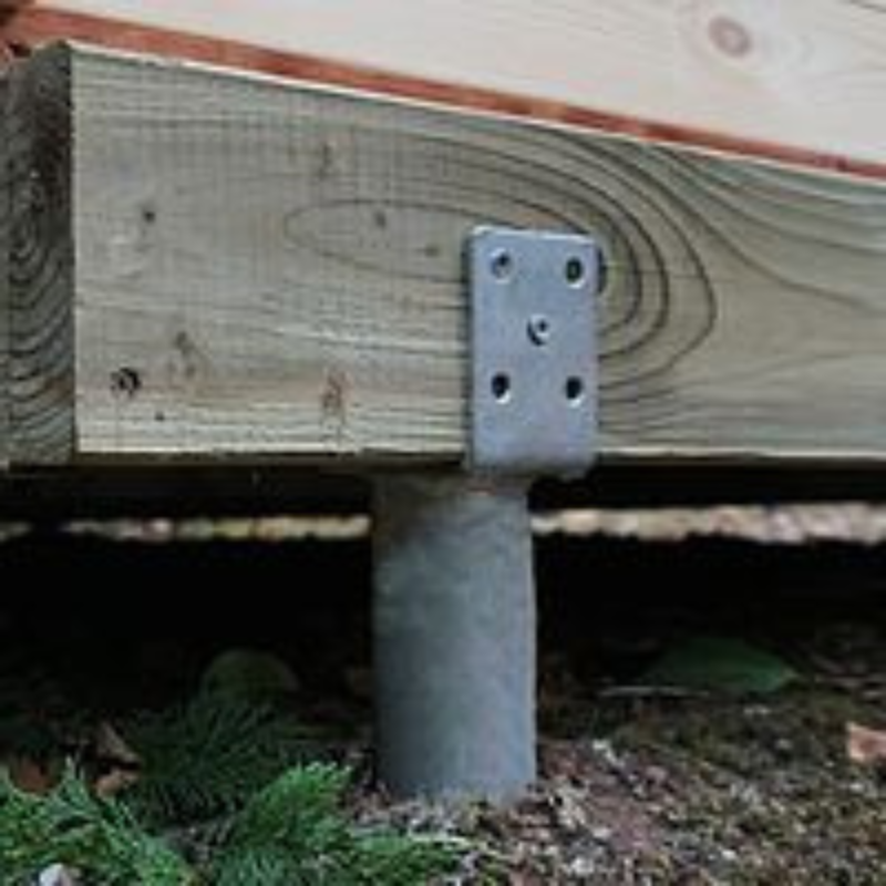 Wooden post with metal bracket on a wooden surface outdoors