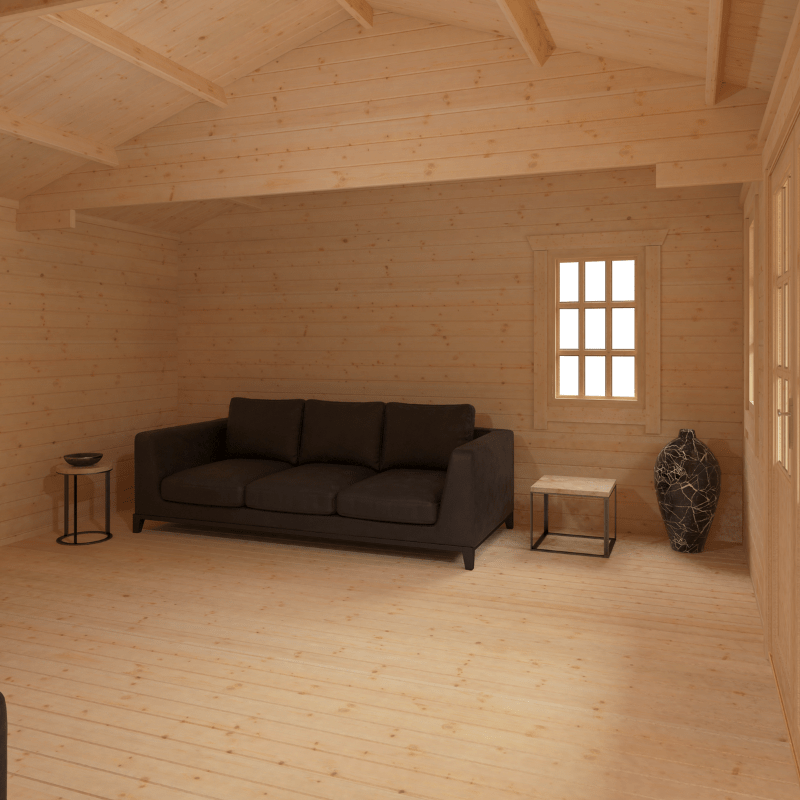 Wooden room with a dark gray sofa and small tables.