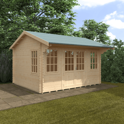 Wooden cabin with a green roof on a grassy area with trees in the background