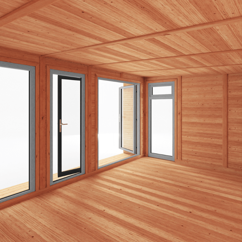 Wooden cabin interior with large windows and a wooden ceiling.